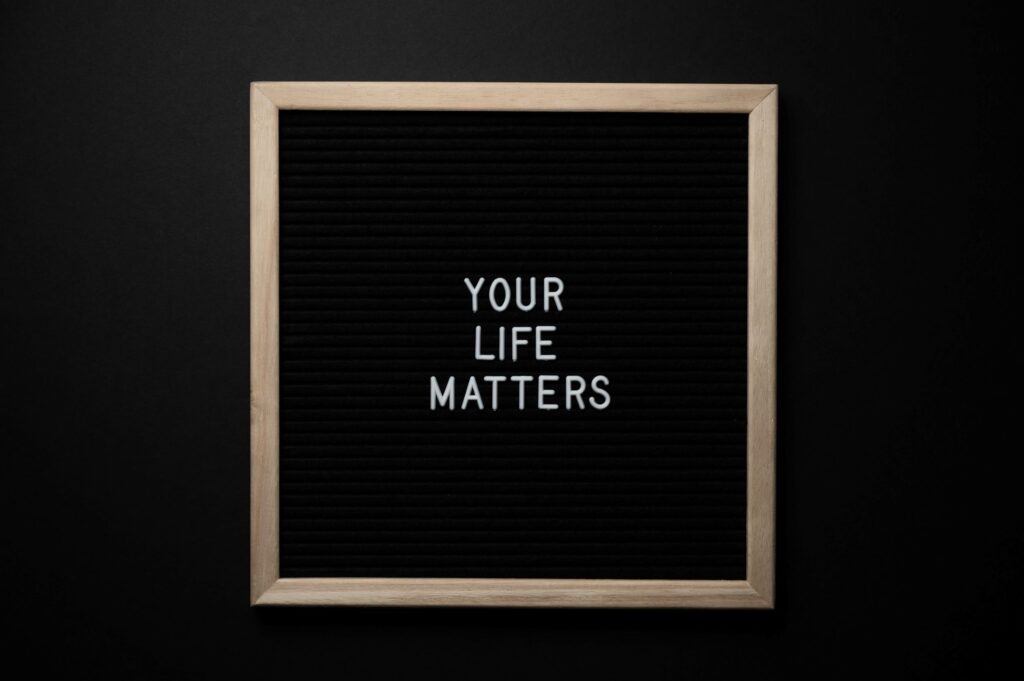 A black frame signs with the saying “Your life matters” implying that all lives matter.